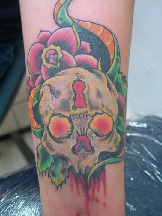 Skull And Snake Close Up Tattoo