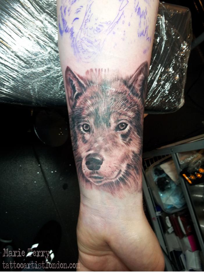 Small Wolf Portrait Tattoo