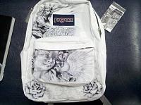 Black ballpoint pen on white untreated jansport backpack