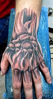 Click image for larger version. 

Name:	skull hand tattoo.jpg 
Views:	76 
Size:	64.4 KB 
ID:	2123